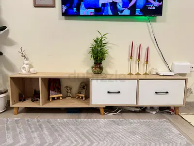 Low wooden TV unit with storage drawers - light oak finish
