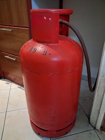 Standard Red Gas Cylinder with Connection Hose and gas stove