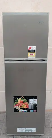 This WHIRLPOOL Refrigerator 255 litres, double door, silver color, condition good working.