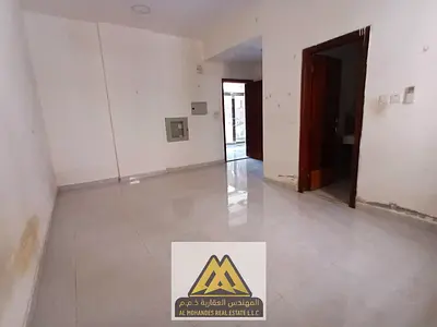 Studio for annual rent in Al Rashidiya 3, Ajman. Ground floor, large space, semi-separated kitchen, quiet location near Amina Hospital. Annual rent AE
