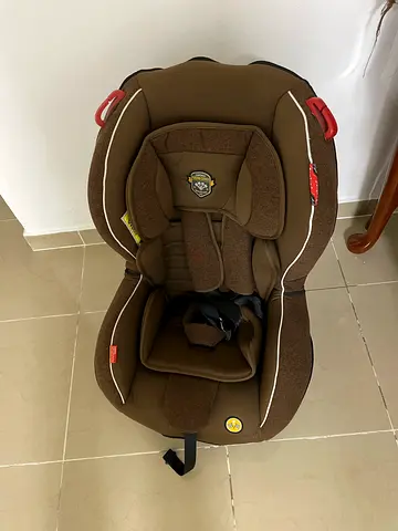 Brown infant car seat - good condition, includes harness insert ,some tear