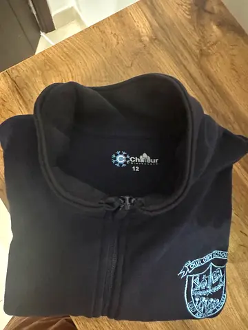 GEMS Our Own English Highschool Dark blue sweater with school crest, size 12