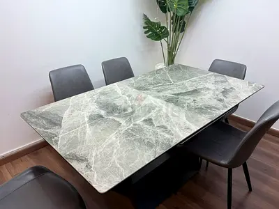 Modern green marble-top dining table with 6 chairs