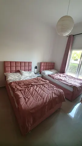 Set of 2 single beds with padded headboards and mattresses