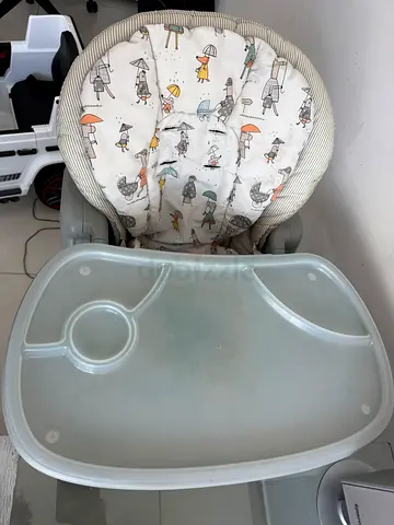 Used baby high chair with adjustable heights and removable feeding tray