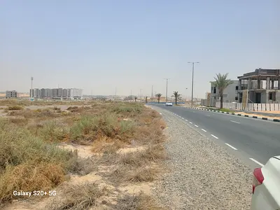 At road residential plot for building G+3/ tilal city sharjah