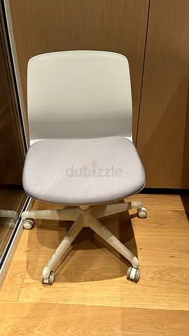 Compact white swivel office chair with light grey cushion