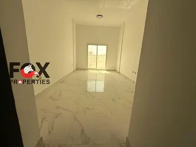 Luxury 1BR apartment for yearly rent in Al Mowaihat 3, brand-new building, first tenant, balcony, open view, 2 bathrooms, prime location.