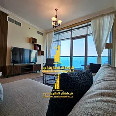 Luxury two-bedroom apartment with a sea view in Ajman - Corniche - Residence Towers - furnished, ava