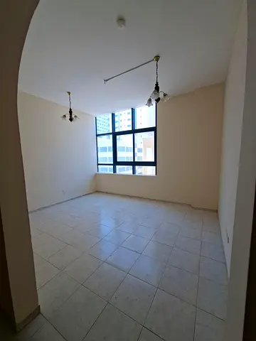 1BHK for rent in Al Majaz 3, Sharjah. Spacious layout, elegant finishing, 2 bathrooms, central AC. Annual rent AED 35,000. Payment in 4 or 6 cheques.