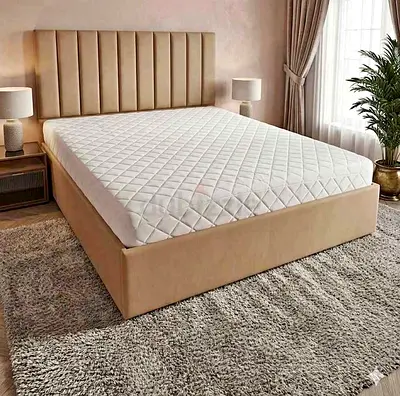 Beige upholstered double bed frame with headboard