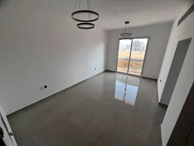 Brand new building, first occupancy in Al Jurf 3, top-of-the-line finishes, prime location, balcony with open view, at a reasonable price