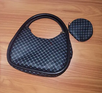 Black patterned crescent handbag with matching coin pouch - gently used