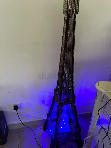 Eiffel tower stand multicolored lights