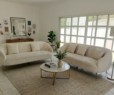 Pair of cream curved 3+3seater sofas in excellent condition