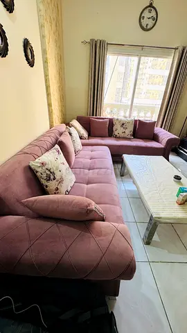 L-shaped mauve fabric sofa cum bed with storage - good condition, comfortable seating