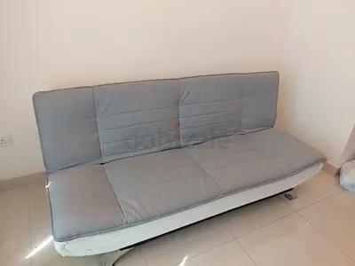 Grey fabric 3-seater sofa bed in good condition