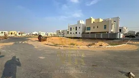 Residential land for sale in a prime location in Al Yasmin area, registration fees included.