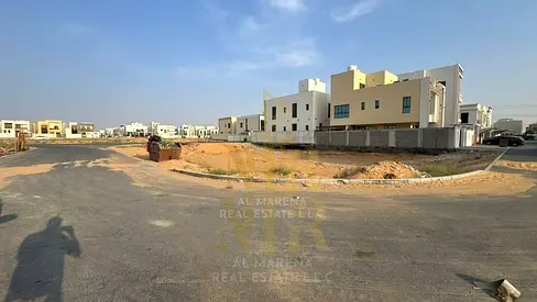 Residential land for sale in a prime location in Al Yasmin area, registration fees included.
