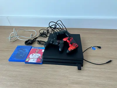 Sony PS4 Pro console bundle with 3 controllers and 2 games - used