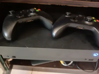 Xbox One X with 2 Wireless Controllers - Good Working Condition
