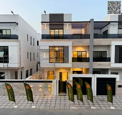 Two-story villa with a rooftop terrace and elevator in one of Ajman's most prestigious areas, on a main street, at a special price.