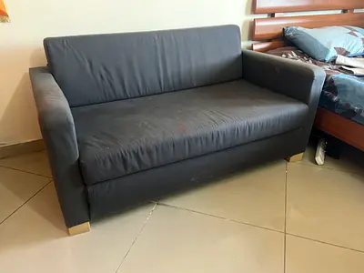 Two-seater dark grey sofa bed - compact sturdy (NO DELIVERY- PICKUP ONLY)