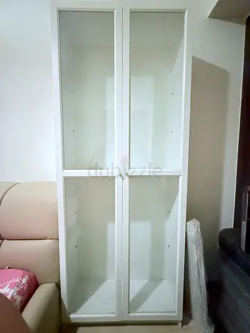 White tall display cabinet with glass doors - good condition