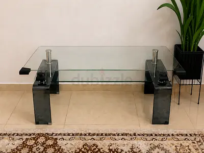 Modern glass coffee table with black legs