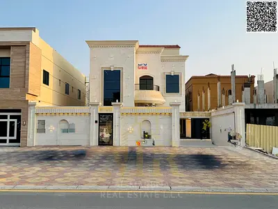 Luxury two-story villa with a rooftop terrace in Al Muwaihat 1, including electricity, water, and air conditioning.