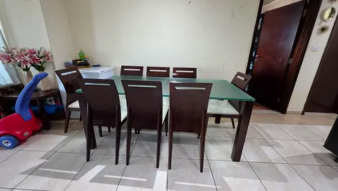 Strong very durable wooden dining table with glass top and 8 dining chairs heavy duty used good