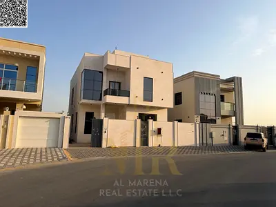 Luxury villa for sale in Al Yasmin | 3014 sq ft | Two floors + roof | 5 master bedrooms | Majlis and living room with washbasins | Modern kitchen + ma
