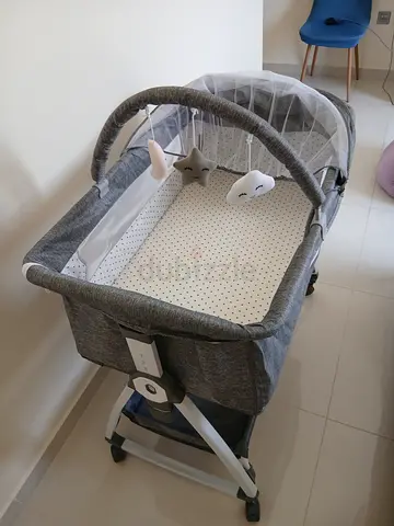 Grey Portable Baby Bassinet with Toy Bar and Mosquito Net