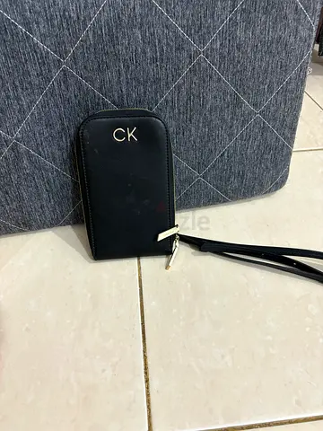 Calvin Klein black wristlet phone pouch with strap