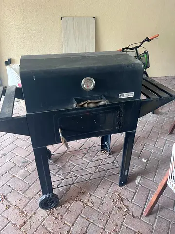 American Gourmet charcoal BBQ grill