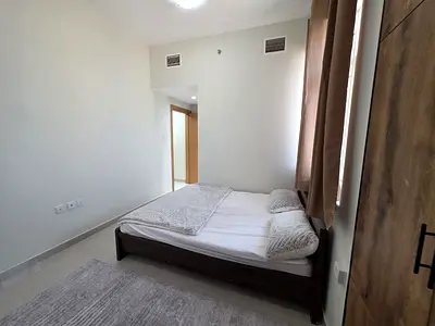 Emirates City For Rent Unfurnished Two bedrooms and a living room Two bathrooms Central air conditioning and cooling system Easy access to Sharjah and