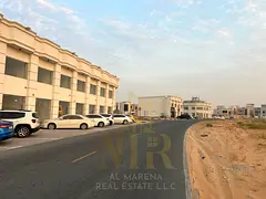 Prime residential/commercial land for sale in Al Zahia, Ajman, with G+2 permit, directly on Sheikh M