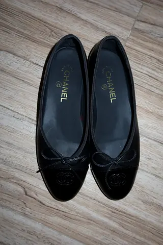 Gently used black leather womens flats, size not specified