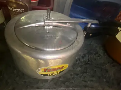 Used aluminum pressure cooker (medium) with lid and handle