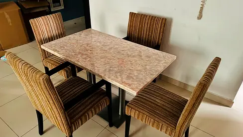 Marble-top dining table with 4 striped upholstered chairs