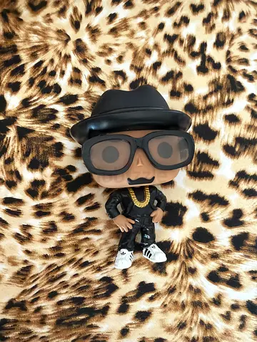 Funko Pop-style hip hop figurine with gold chain and sunglasses