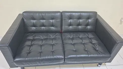 Black leather 2-seater ikea sofa in good condition