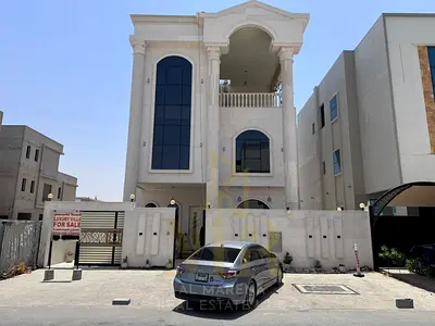 🏡 فيلا فاخرة للبيع في العامرة – عجمان | 5 غرف نوم ماستر + غرفة خادمة | طابقين + روف | تكييف مركزي | مساحة بناء 5,000 قدم² | مساحة أرض 3,014 قدم² | شا