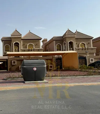 Villa in Al Muwaihat area, 2 residential and commercial units, price includes electricity, water, and air conditioning. Freehold ownership for all nat