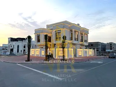 Luxury classic villa for sale in Ajman Al Helio 2, corner lot facing a park and amenities, 6 master bedrooms, swimming pool, land area 4300 sq ft, bui
