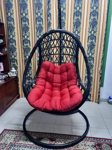 Black Rattan-style Hanging Egg Chair with Red Cushion