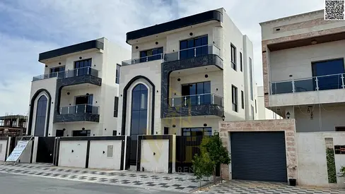 Two-story villa with a rooftop terrace, priced at a special price including registration and ownership fees, in one of Ajman's most prestigious areas.