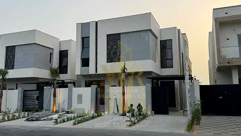Luxury villa for sale in Al Zahia, Ajman, on Emirates Road exit, including electricity, water, and air conditioning, at a special price.