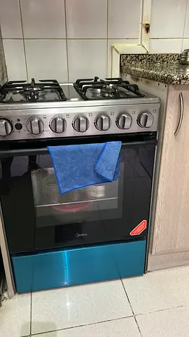 Midea 4-Burner Gas Cooker with Built-in Oven - Good Working Condition