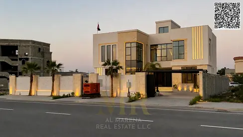 Two-story villa with a rooftop terrace and private pool in one of Ajman's most prestigious areas, on a main street, with all fees included.